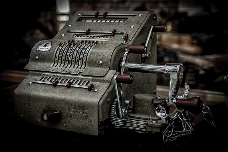 Figure 7: (a) Mechanical calculators